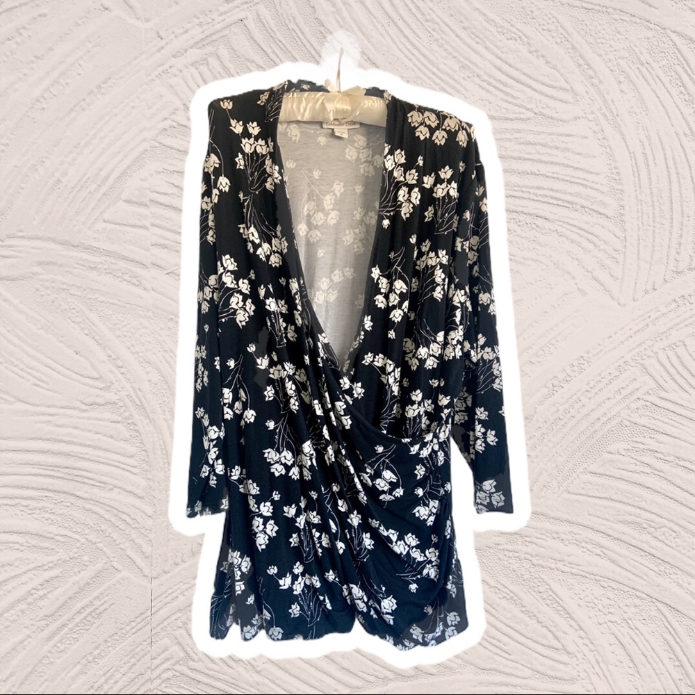 Black and white v-neck gathered and draped blouse.